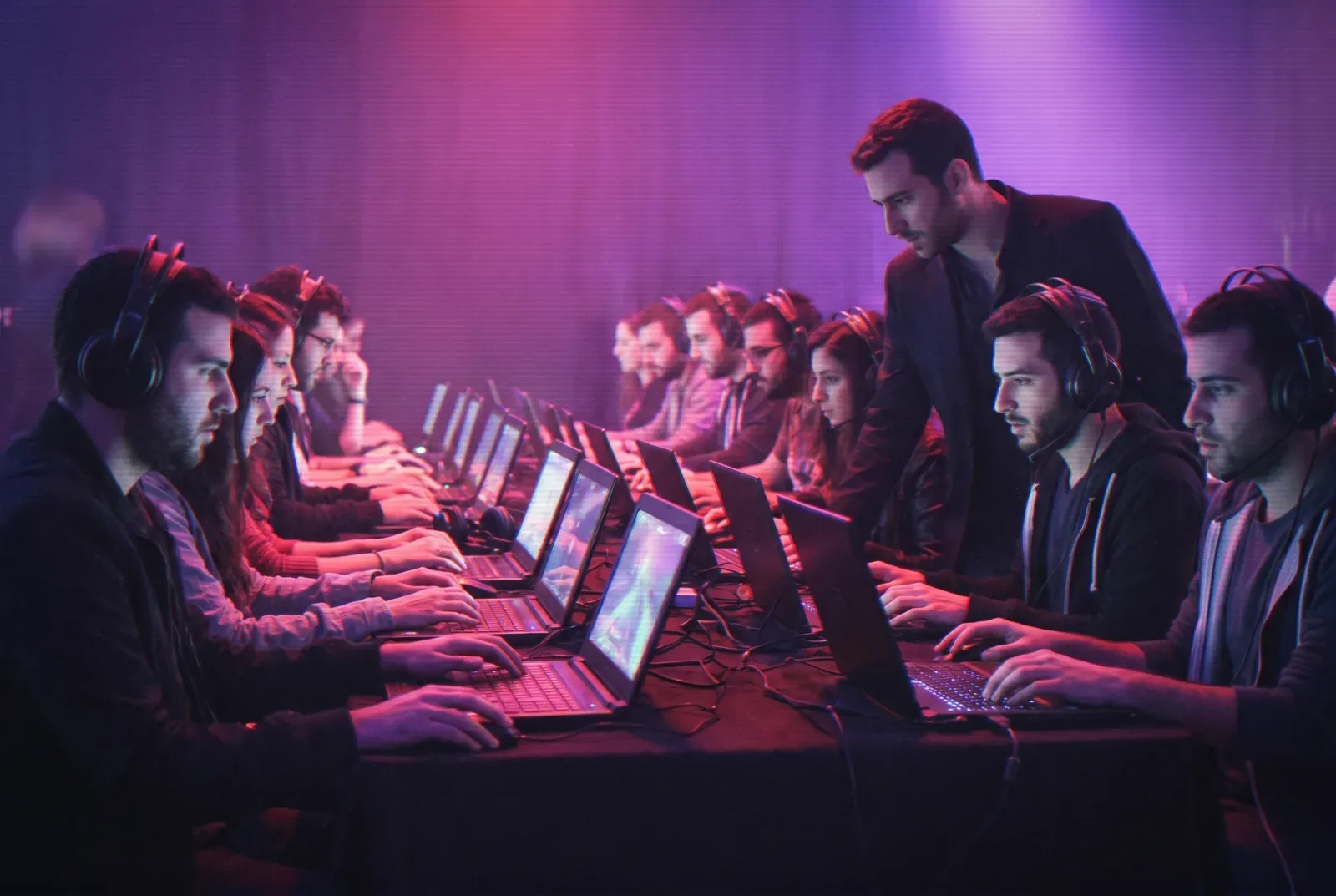 A row of gaming stations in the event hall