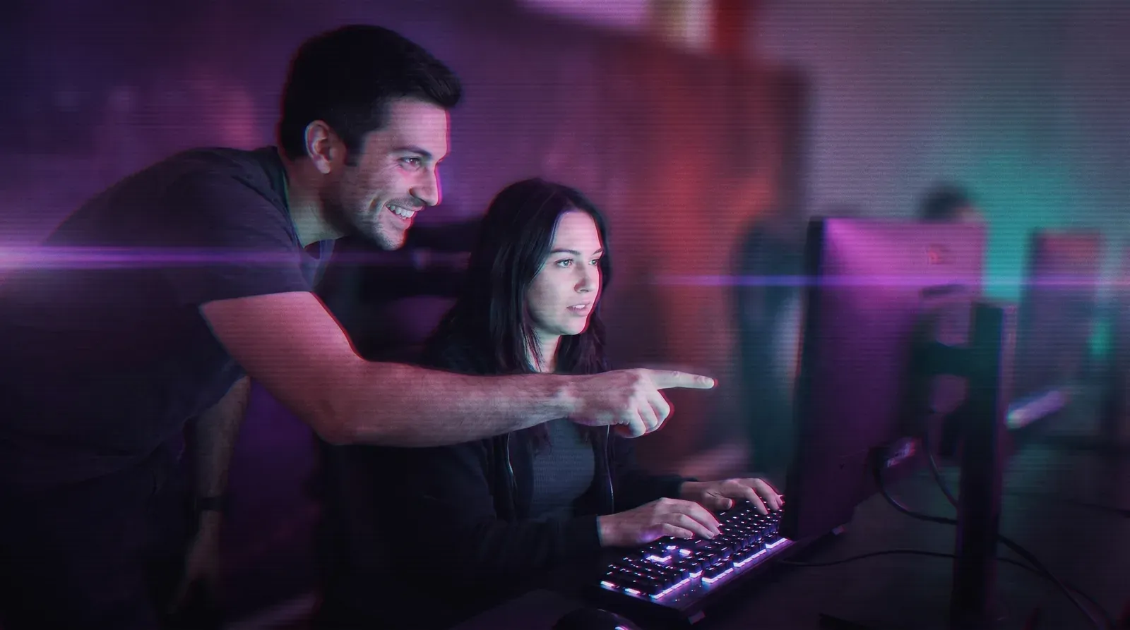 Two participants at a gaming station