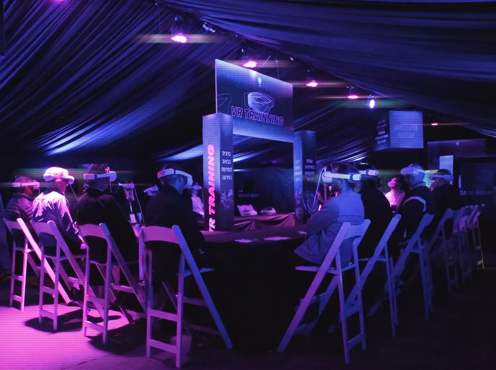 An instructor and participants at the VR stations
