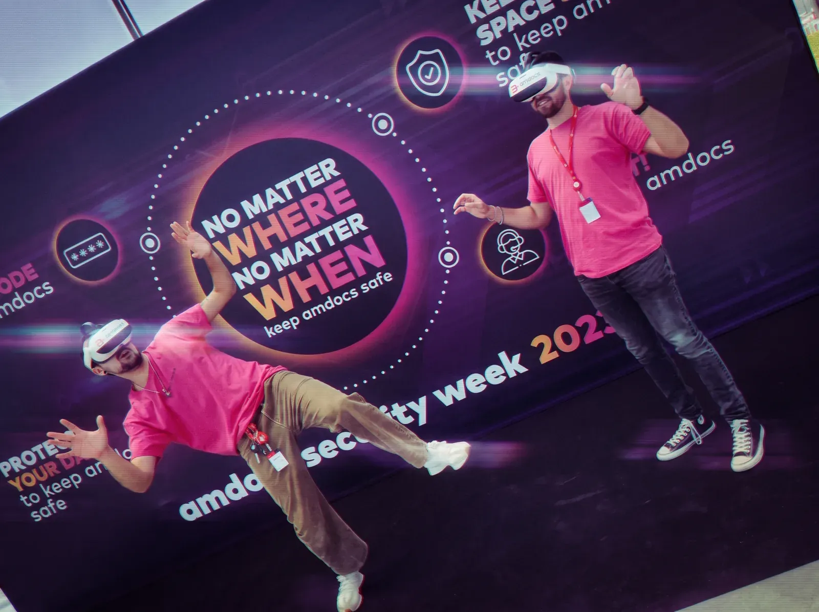 A participant in a VR headset by the banner